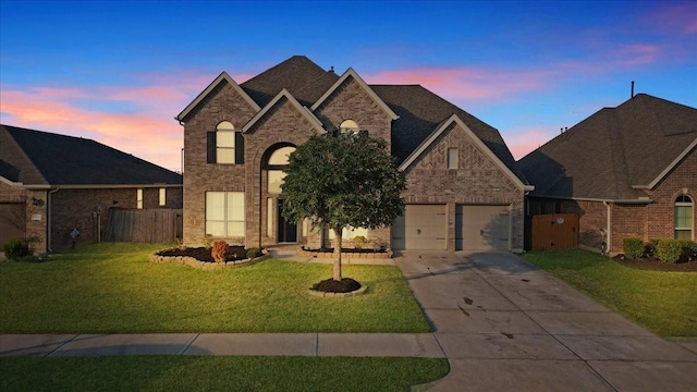 view of front of house with a lawn and a garage