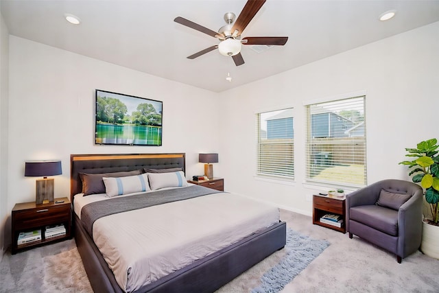 carpeted bedroom with ceiling fan