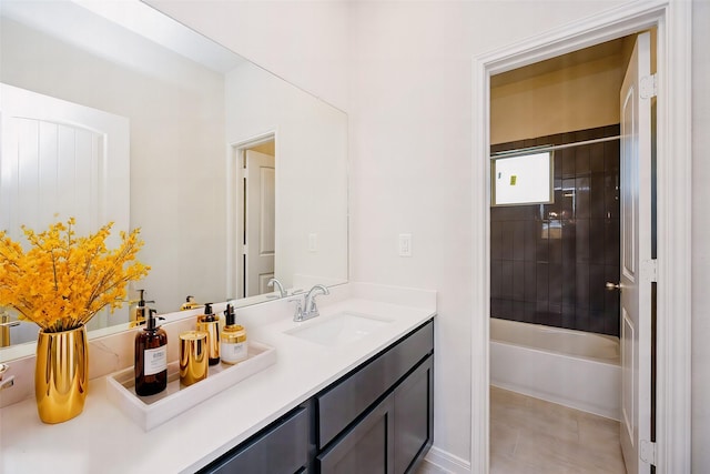 bathroom with vanity and tiled shower / bath combo