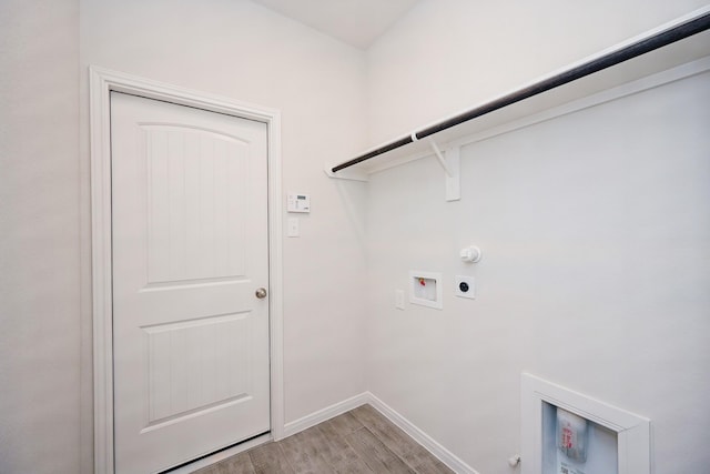 laundry room featuring hookup for a gas dryer, hookup for an electric dryer, washer hookup, and light hardwood / wood-style floors