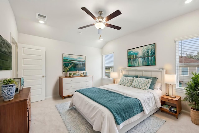 carpeted bedroom with lofted ceiling and ceiling fan