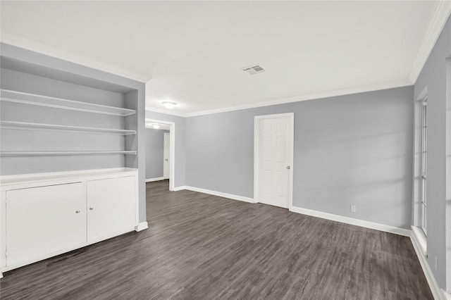 interior space featuring dark hardwood / wood-style floors and crown molding