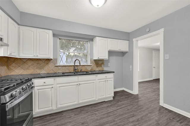 kitchen featuring white cabinetry, stainless steel range, sink, tasteful backsplash, and dark hardwood / wood-style floors