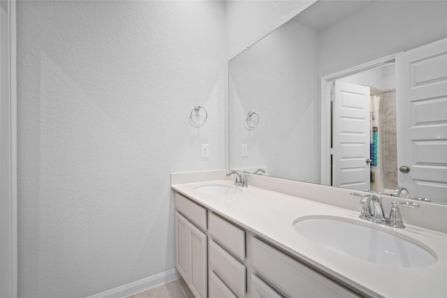 bathroom with bathing tub / shower combination, tile patterned flooring, and vanity