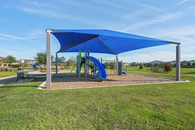 view of jungle gym featuring a lawn