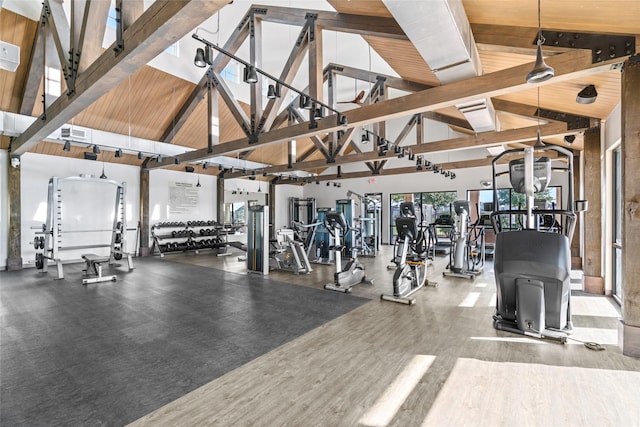 workout area with hardwood / wood-style floors, high vaulted ceiling, and wood ceiling