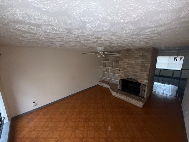 unfurnished living room with parquet floors, a textured ceiling, a brick fireplace, and ceiling fan