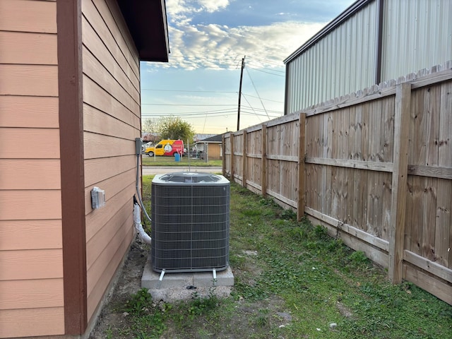 view of yard featuring central air condition unit