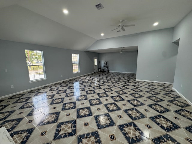 unfurnished living room with vaulted ceiling and ceiling fan