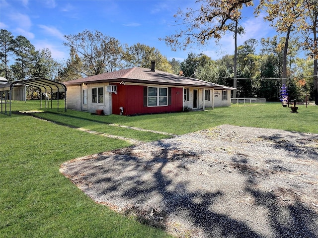 exterior space featuring a yard, a wall mounted air conditioner, and a carport