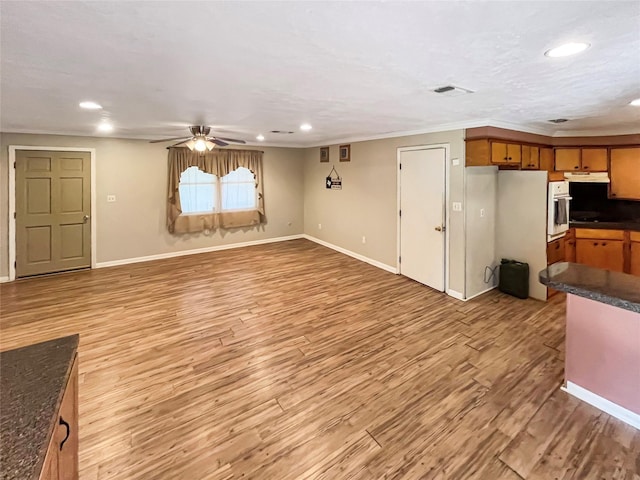 living room with ceiling fan, crown molding, and light hardwood / wood-style flooring