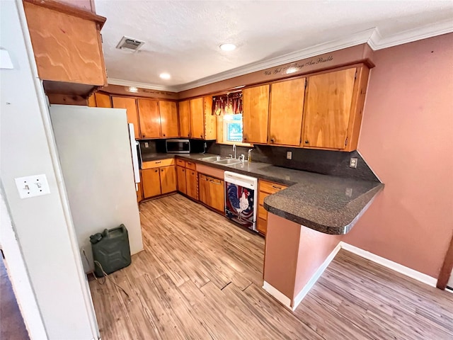 kitchen featuring dishwasher, sink, kitchen peninsula, crown molding, and light hardwood / wood-style floors