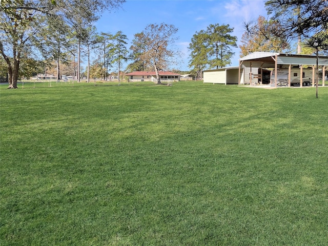 view of yard with a carport