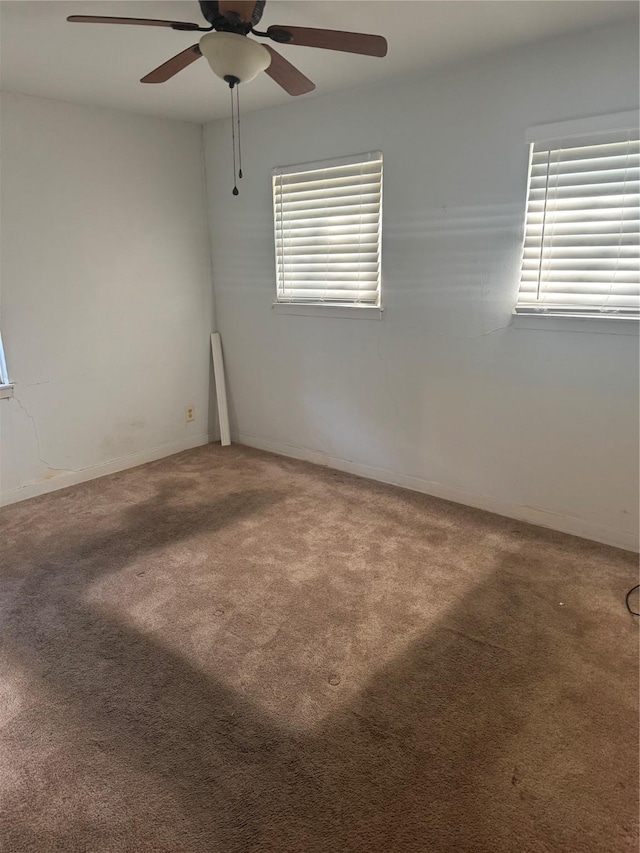 spare room featuring carpet floors and a healthy amount of sunlight