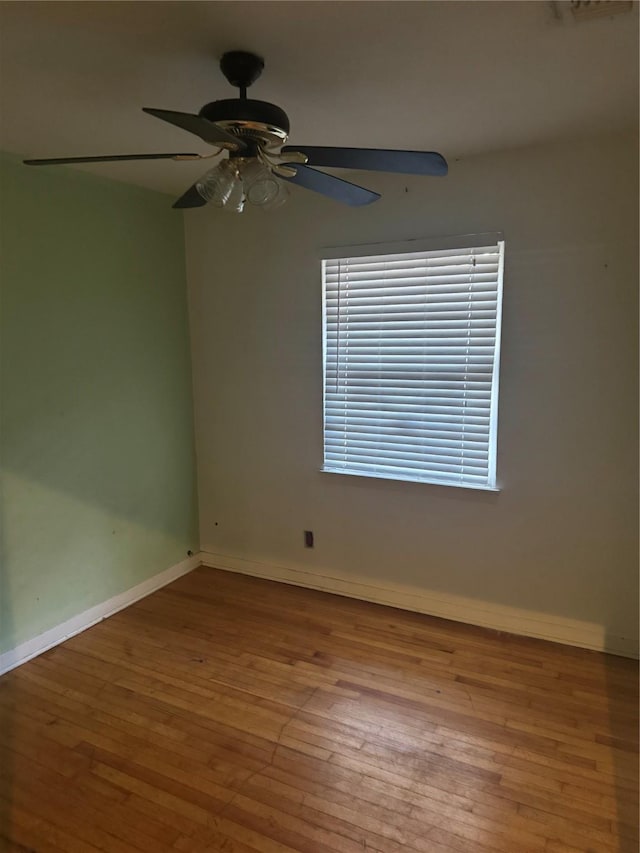 unfurnished room featuring light hardwood / wood-style floors and ceiling fan