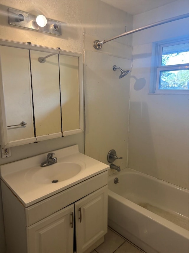 bathroom with tile patterned floors, vanity, and shower / bathing tub combination