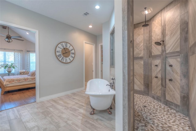 bathroom featuring ceiling fan, hardwood / wood-style floors, vaulted ceiling, and shower with separate bathtub