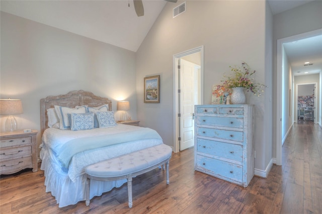 bedroom featuring ceiling fan, dark hardwood / wood-style flooring, and high vaulted ceiling