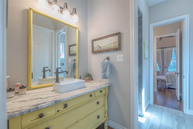 bathroom featuring hardwood / wood-style floors and vanity