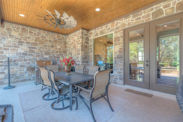 view of patio featuring french doors and ceiling fan