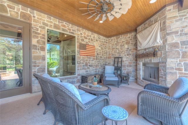 view of patio with an outdoor stone fireplace