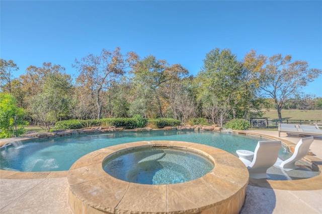 view of swimming pool featuring an in ground hot tub