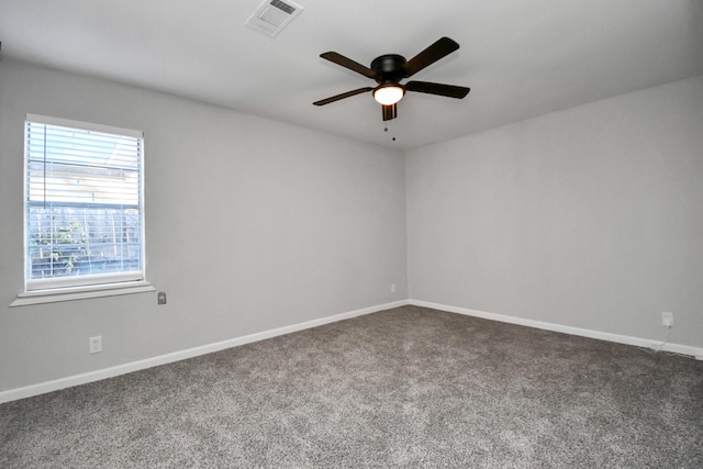 spare room featuring carpet flooring and ceiling fan