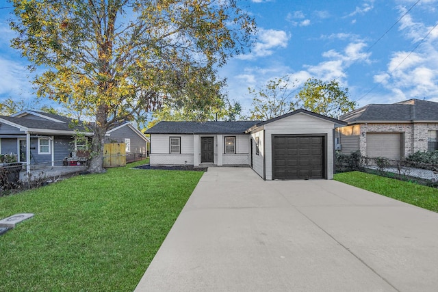 single story home featuring a front yard and a garage