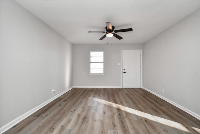 unfurnished room with light hardwood / wood-style floors and ceiling fan