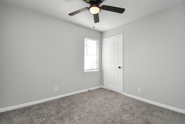 spare room featuring carpet flooring and ceiling fan