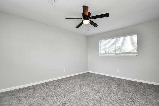 spare room with ceiling fan and carpet floors