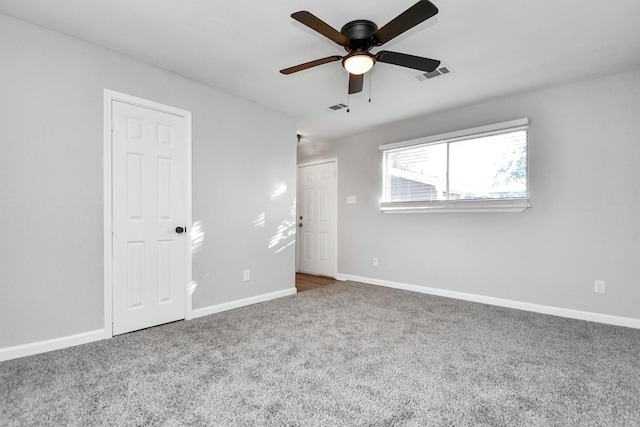 unfurnished bedroom featuring ceiling fan and carpet