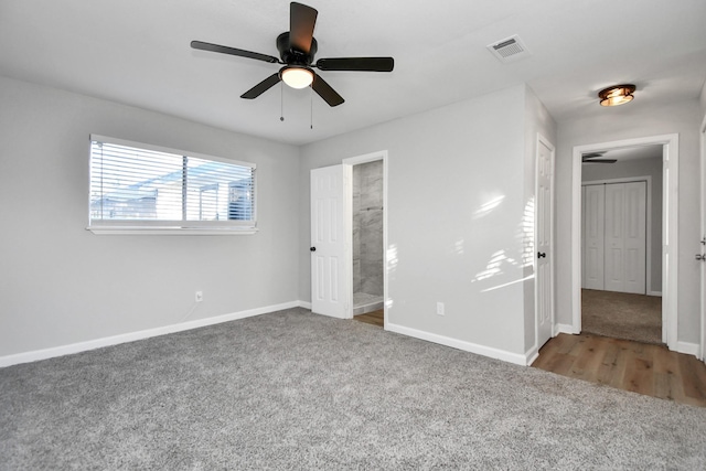 unfurnished bedroom with ceiling fan and carpet