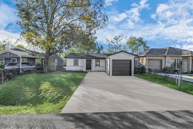 view of front of home featuring a front yard and a garage