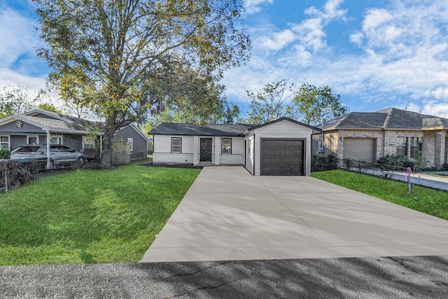 view of front of home featuring a front lawn and a garage