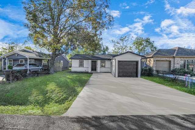 single story home with a garage and a front lawn