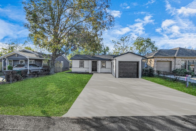 single story home featuring a garage and a front lawn