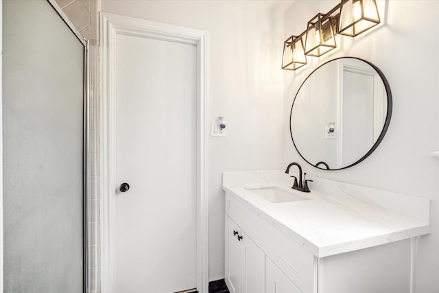 bathroom featuring vanity and an enclosed shower