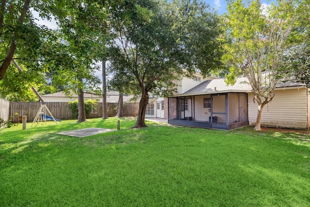 view of yard with a sunroom