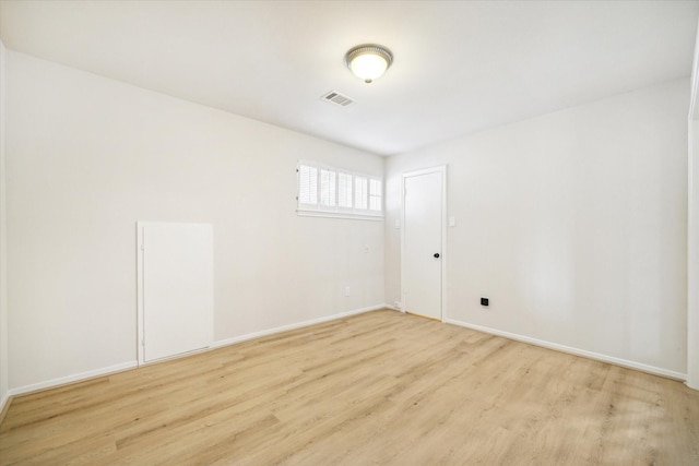 empty room with light hardwood / wood-style floors