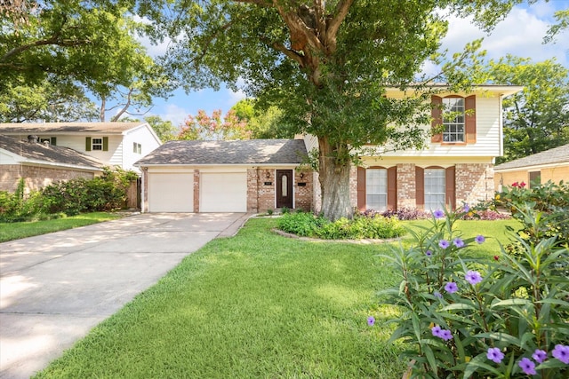 view of front of house with a front yard and a garage