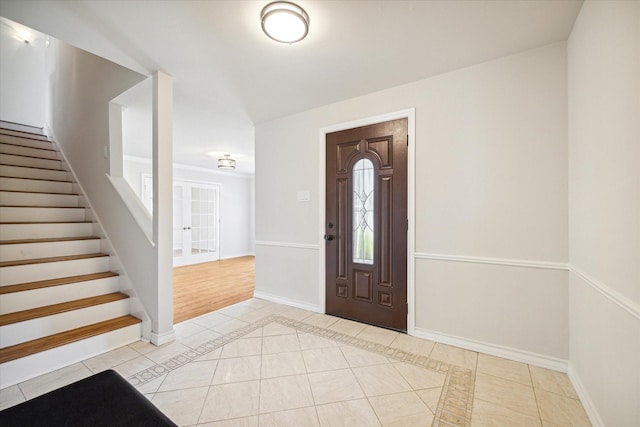 entrance foyer featuring light tile patterned floors