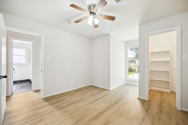 unfurnished room with ceiling fan and light hardwood / wood-style flooring