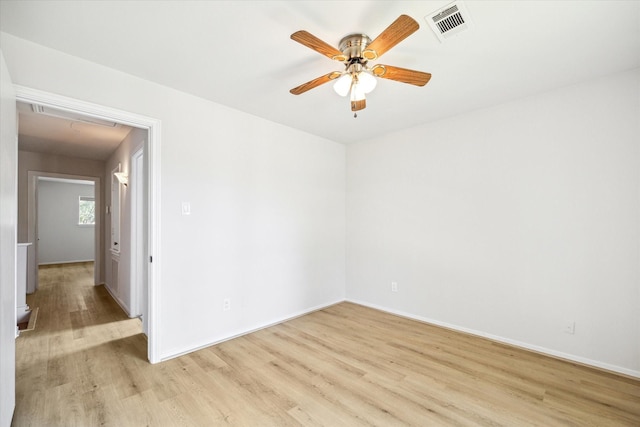 unfurnished room featuring light wood-type flooring and ceiling fan