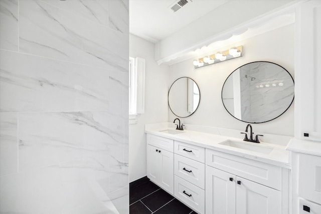 bathroom featuring tile patterned floors and vanity