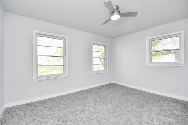 unfurnished room with carpet flooring and ceiling fan