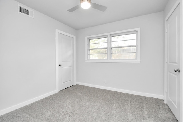 unfurnished bedroom with carpet floors and ceiling fan