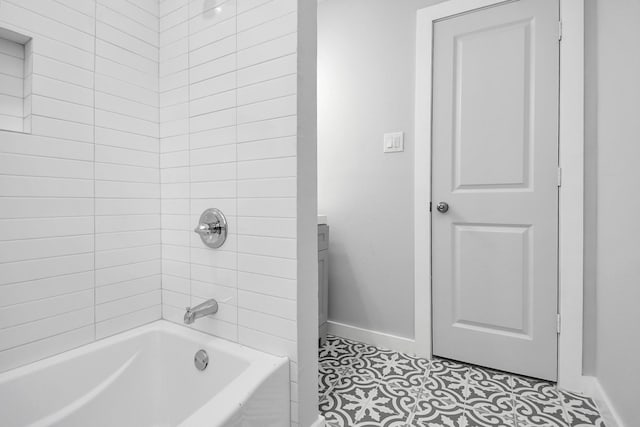 bathroom with tile patterned flooring and tiled shower / bath combo