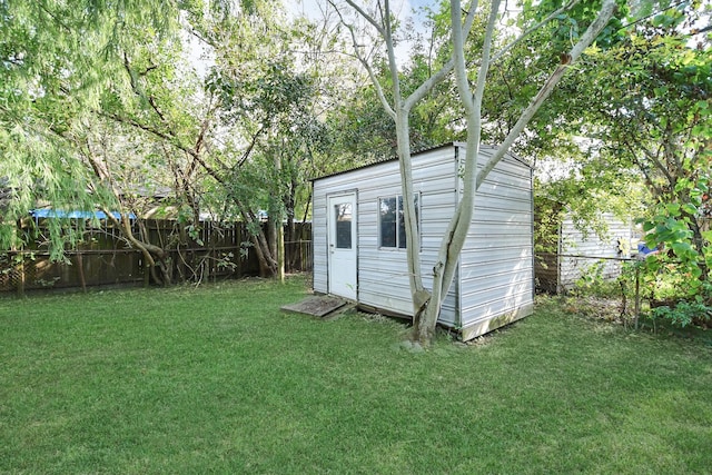 view of outbuilding with a lawn