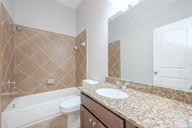 full bathroom with tile patterned flooring, vanity, toilet, and tiled shower / bath combo